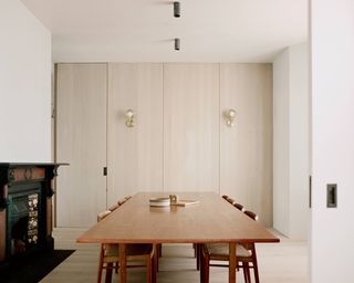 Dining table in renovated modern living space (photograph by Simone Bossi)