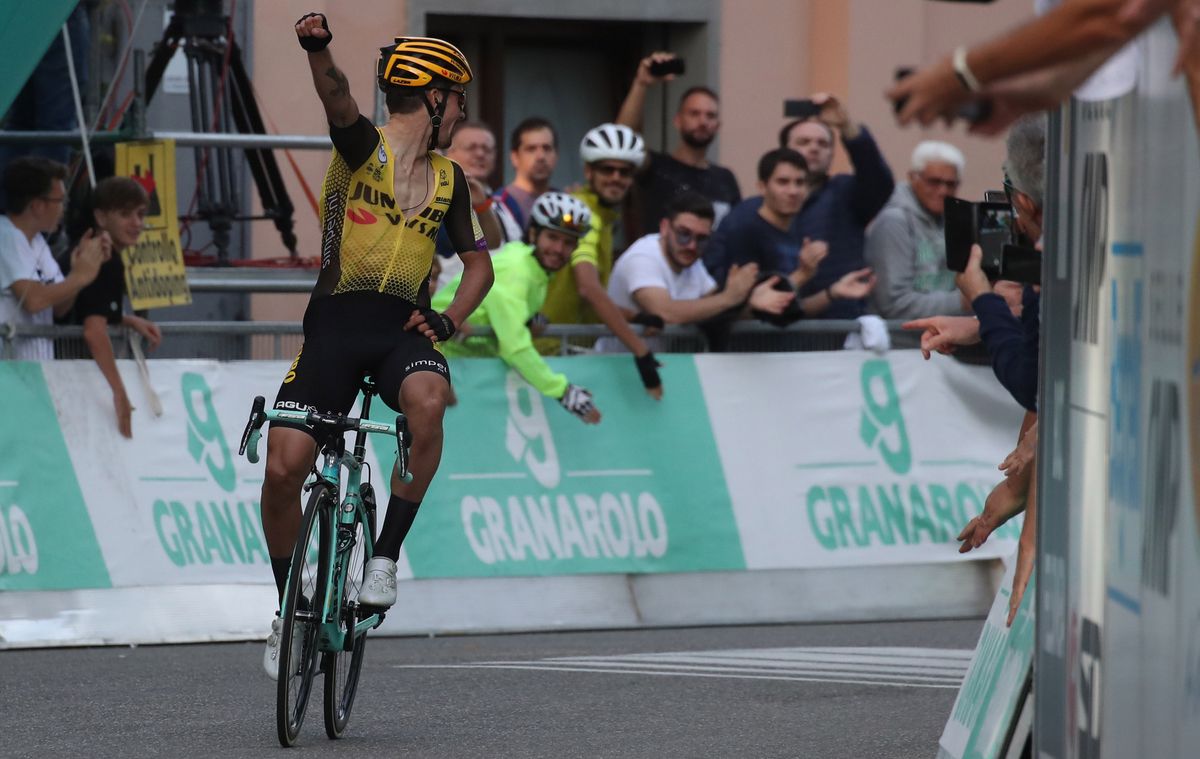 Primoz Roglic (Jumbo-Visma) checks behind as he crosses the line