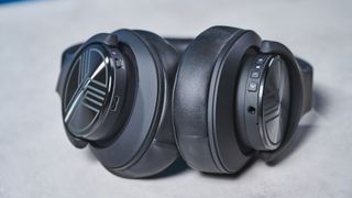 A black Treblab Z2 over-hear headset with a gray logo on each earcup