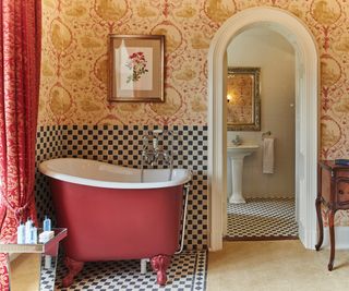 red small tub freestanding bath in period property