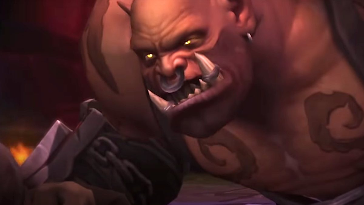 Garrosh Hellscream looks angrily up at Thrall, who is about to whack him with a hammer, in World of Warcraft: Mists of Pandaria.