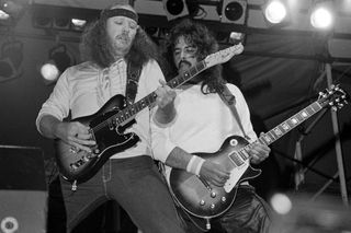 Hughie Thomasson and Freddie Salem and The Outlaws perform as part of the Dr. Pepper Music Festival Series on Pier 84 on June 26, 1982 in New York City