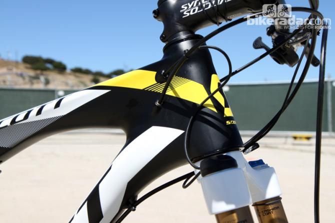The tapered head tube is surrounded by several wires.