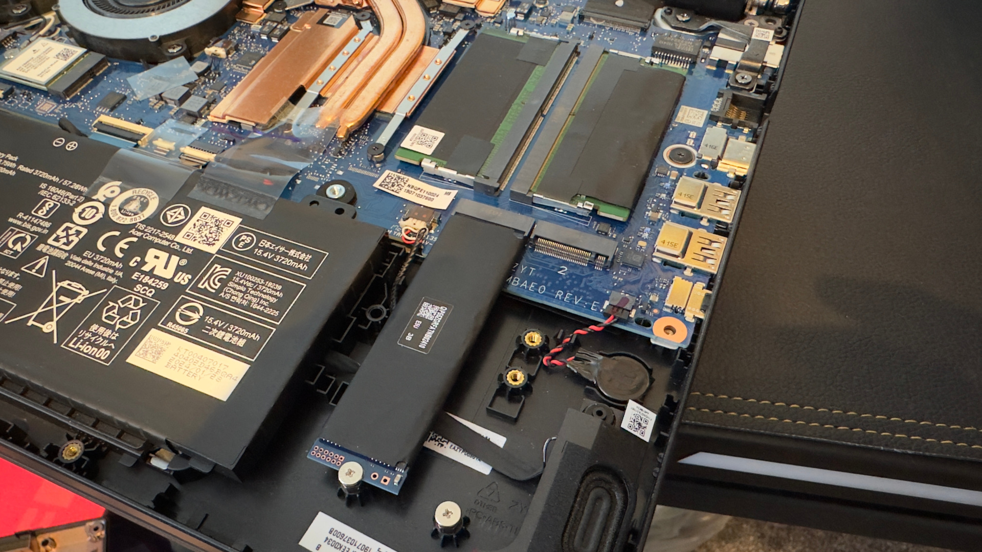 A photo of the interior of an Acer Nitro V 15 gaming laptop showing the RAM and SSD