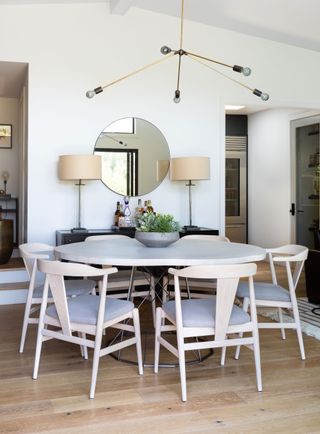 dining area with round table and neutral color scheme