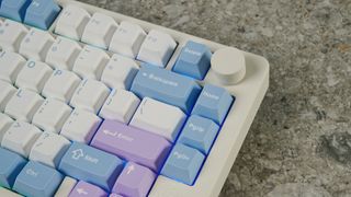 A pink, blue and white Gamakay TK75 Pro wireless mechanical keyboard with hot-swappable linear switches