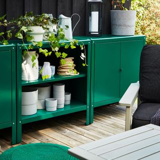 outdoor storage with plants and chair