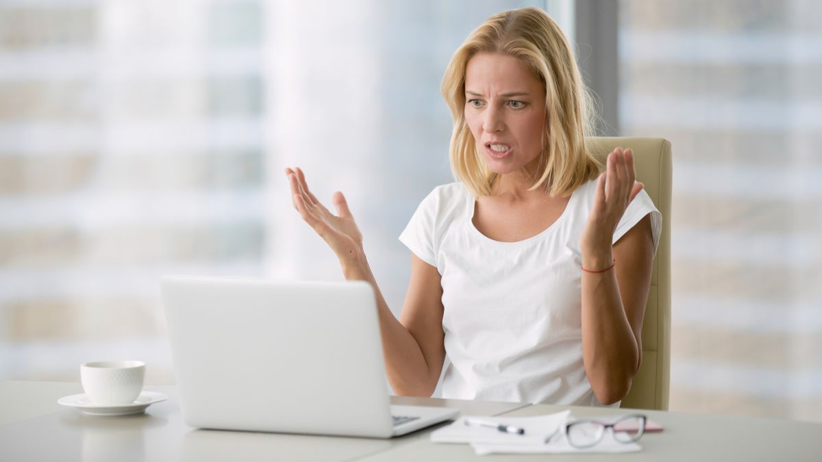 Woman angry at her laptop