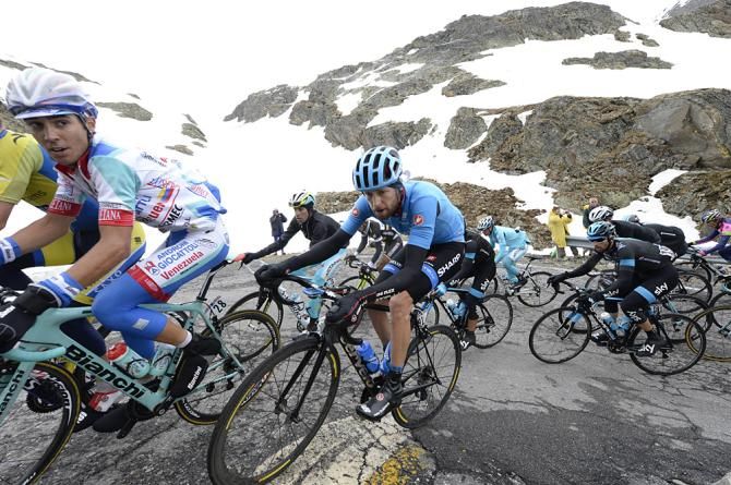 Riders make their way up the Gavia