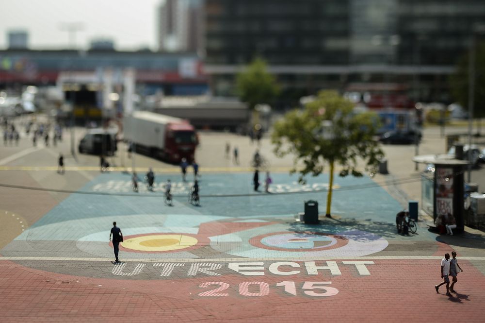 People walk over a giant mural for the race.