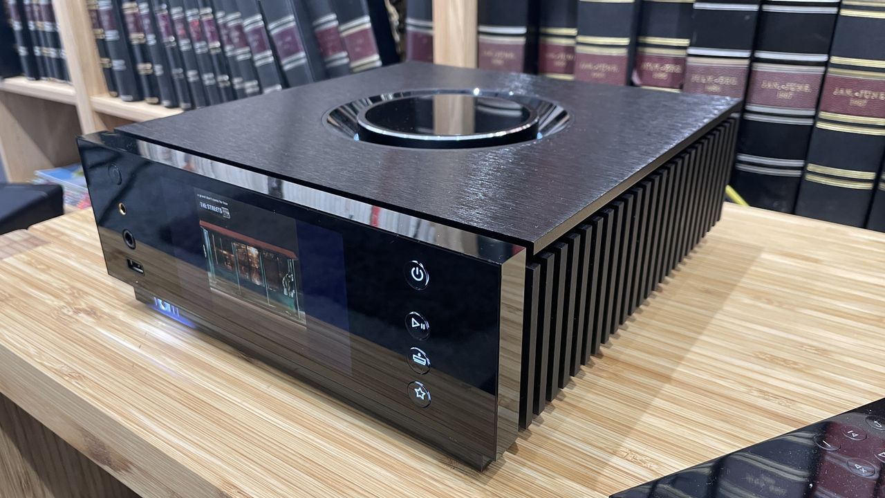 Naim Uniti Atom Headphone Edition on wooden rack