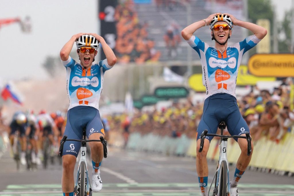 Team DSM-Firmenich PostNL team's French rider Romain Bardet cycles to the finish line ahead of Team DSM-Firmenich PostNL team's Belgian rider Frank Van Den Broek (L) to win the 1st stage of the 111th edition of the Tour de France cycling race, 206 km between Florence and Rimini, in Italy, on June 29, 2024. (Photo by Thomas SAMSON / AFP)