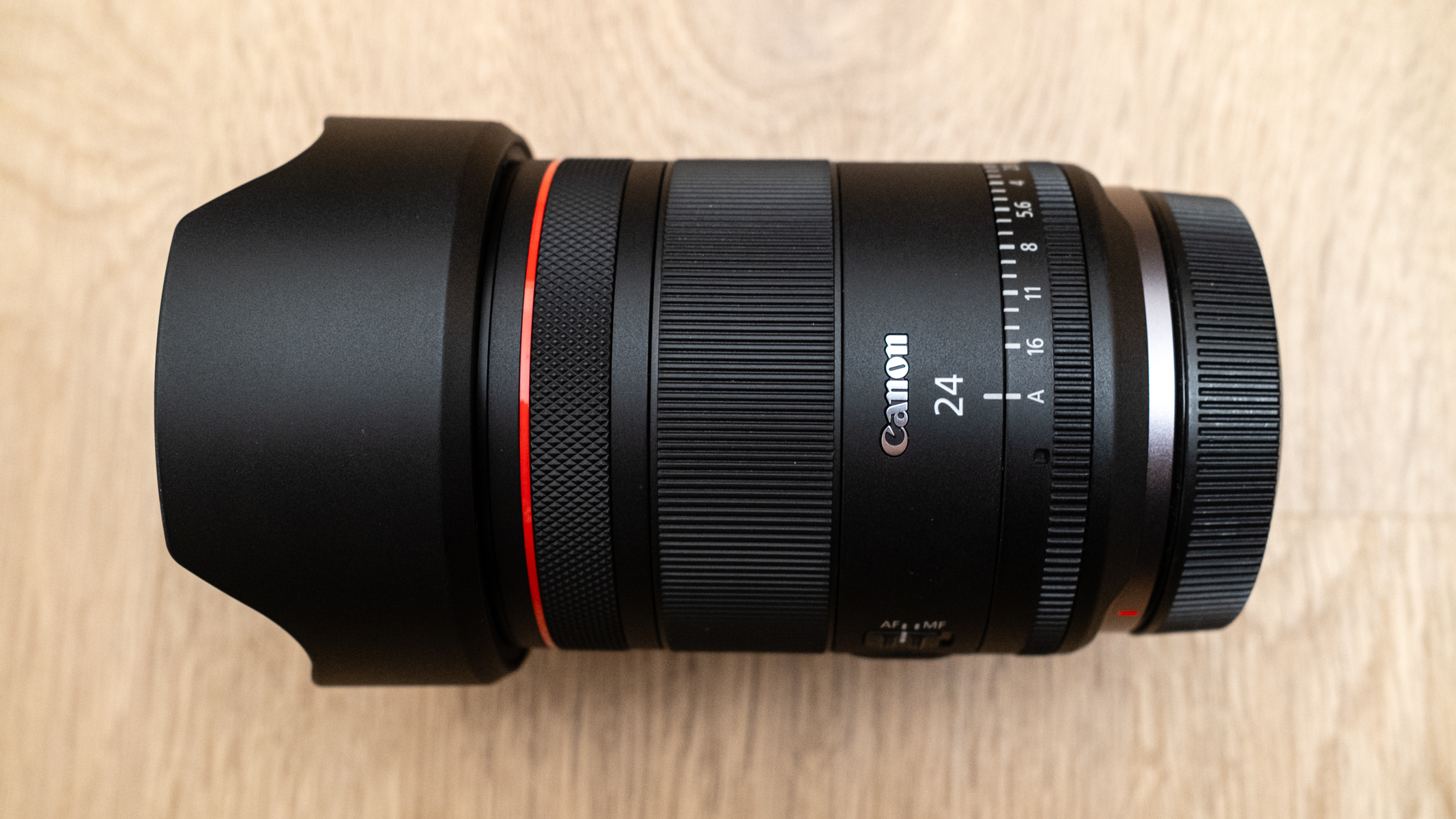 Canon RF 24mm f/1.4L VCM with its lens hood attached