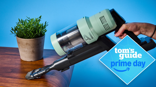 the samsung bespoke jet AI ultra vacuum in the handheld mode, showing it cleaning a table, with a tom's guide prime day deals badge