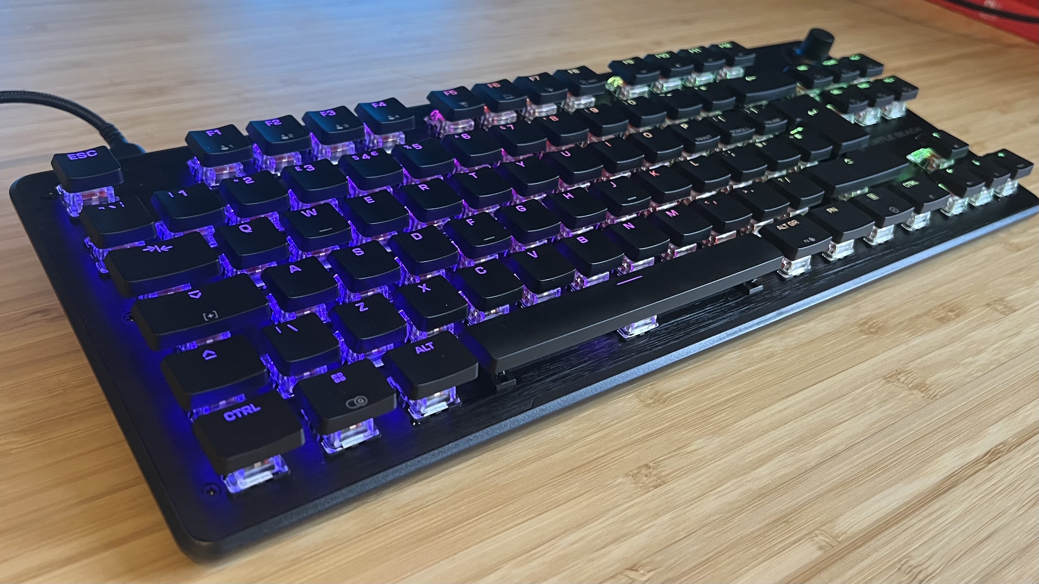 Turtle Beach Vulcan II TKL gaming keyboard on a wooden desk