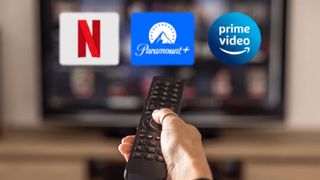 Netflix, Paramount Plus and Prime Video logos on TV with remote