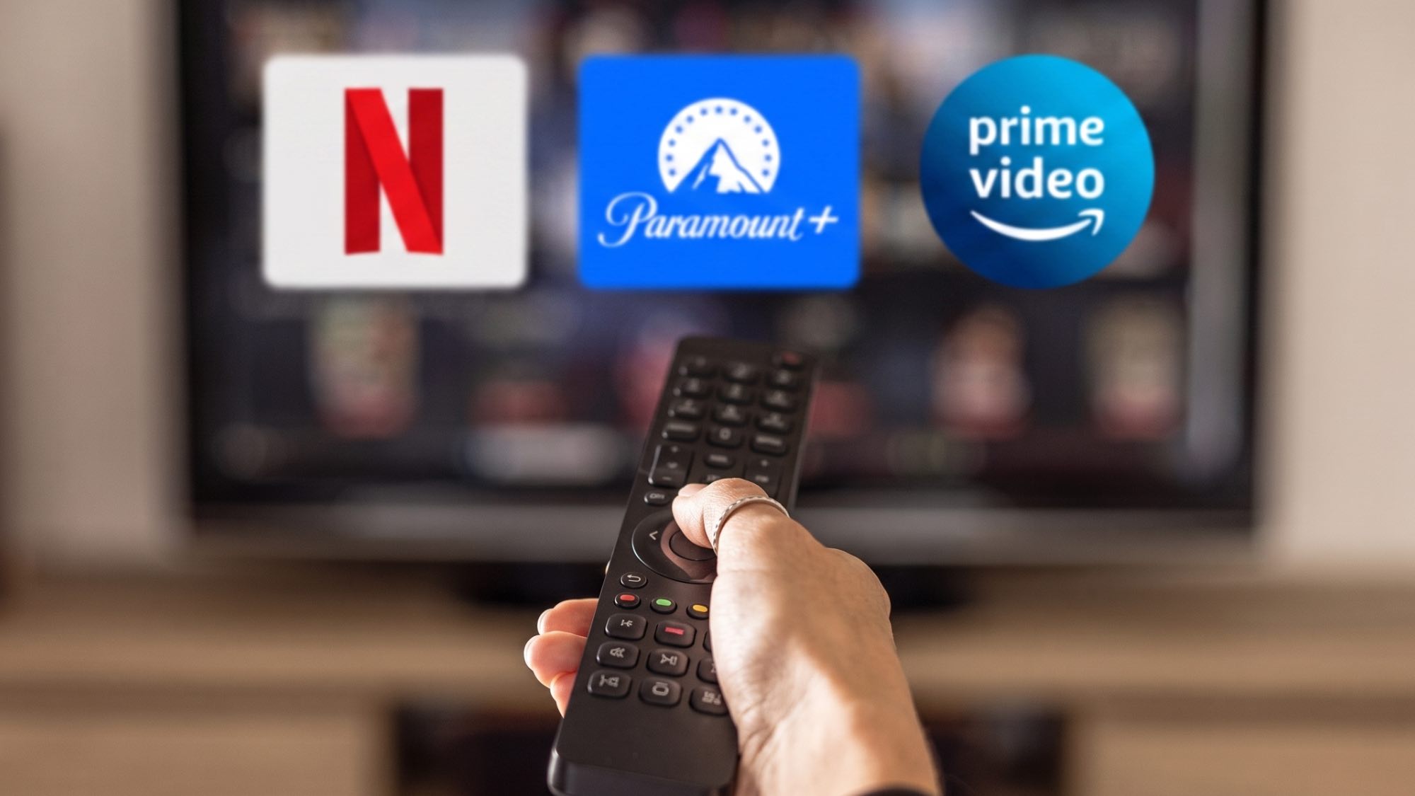 Netflix, Paramount Plus and Prime Video logos on TV with remote