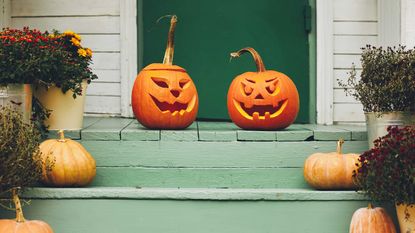 carved pumpkins on doorstep