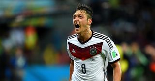 Mesut Oezil of Germany celebrates scoring his team's second goal during the 2014 FIFA World Cup Brazil Round of 16 match between Germany and Algeria at Estadio Beira-Rio on June 30, 2014 in Porto Alegre, Brazil.