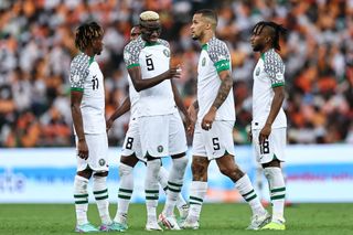 Nigeria AFCON 2023 squad: Nigeria's forward #9 Victor Osimhen (C) reacts next to his teammates during the Africa Cup of Nations (CAN) 2024 group A football match between Ivory Coast and Nigeria at the Alassane Ouattara Olympic Stadium in Ebimpe, Abidjan, on January 18, 2024. (Photo by FRANCK FIFE / AFP) (Photo by FRANCK FIFE/AFP via Getty Images)