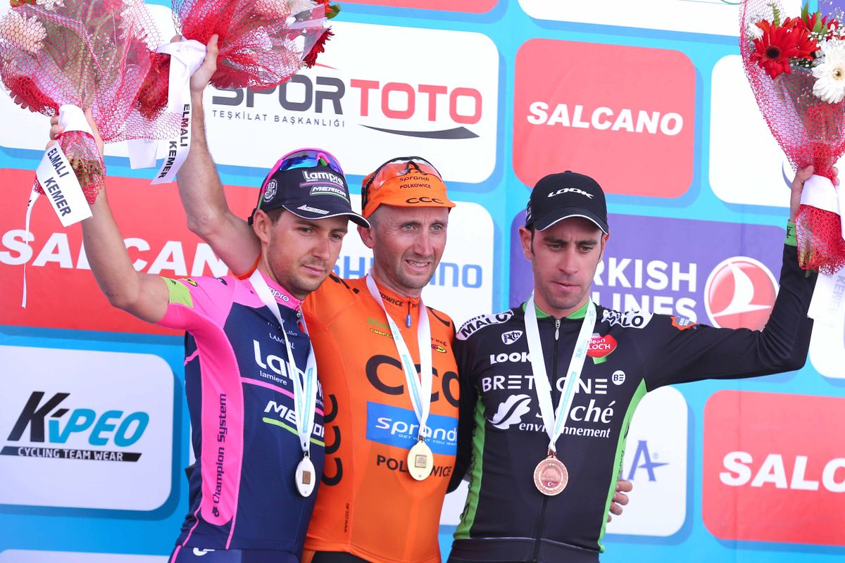 Kristijan Durasek, Davide Rebellin and Eduardo Sepulveda on the stage podium