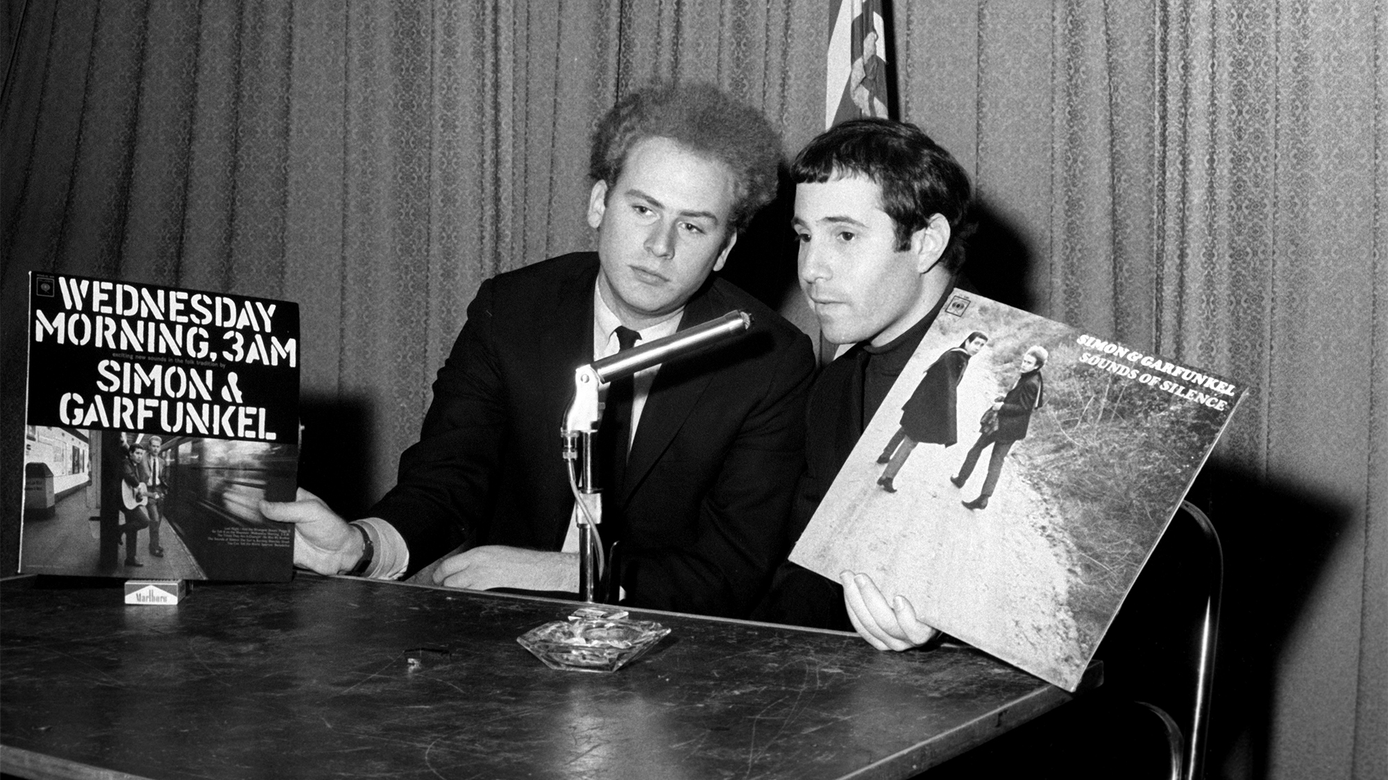 Paul Simon and American singer Art Garfunkel, together as folk-rock duo Simon &amp;amp; Garfunkel, appear for a performance on the campus of Washington University, March 24, 1967, in St. Louis, Missouri.
