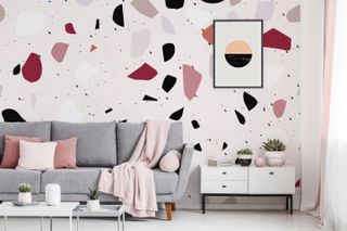 living room with terrazzo mural on wall by pixers