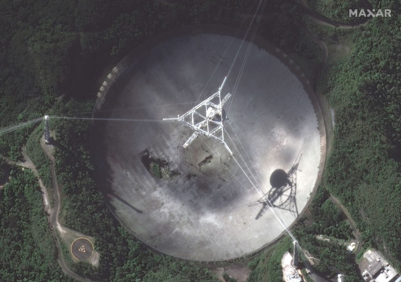 An up-close satellite view of the Arecibo radio telescope's dish.