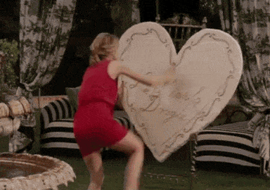 Woman destroying heart-shaped cooking