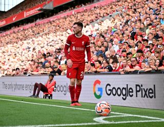 Andy Robertson prepares to take a corner for Liverpool against Bournemouth at Anfield in August 2023.
