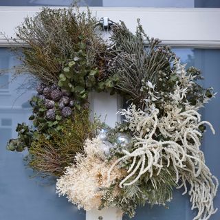 Front door wreath with dried flowers and foliage