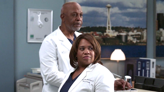 Richard Webber and Miranda Bailey look down the hall of the hospital on Grey's Anatomy.