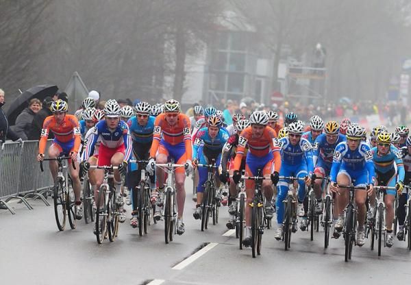The U-23 men start on a long stretch of pavement.
