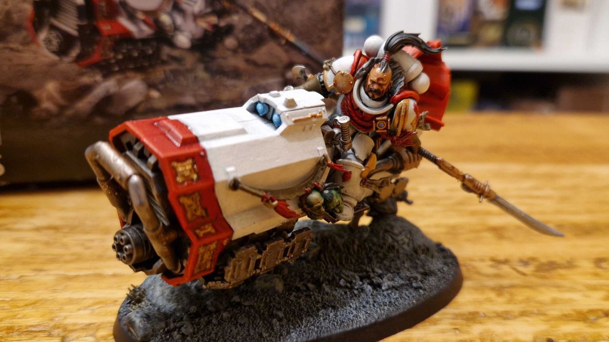 A white-armored Space Marine model on a jet bike