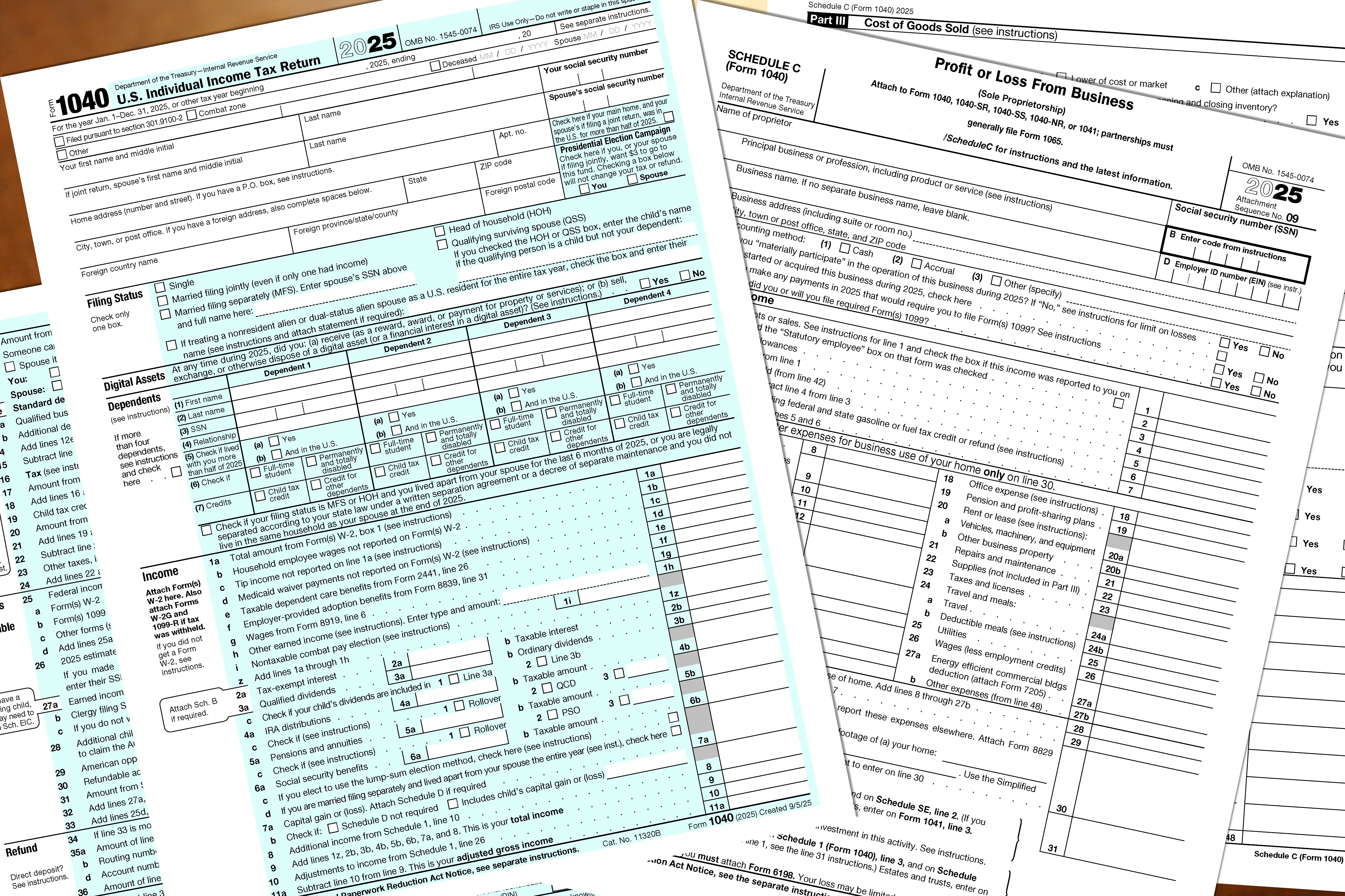 2025 tax year IRS 1040 individual and schedule C profit or loss from business tax forms lay on a desktop.