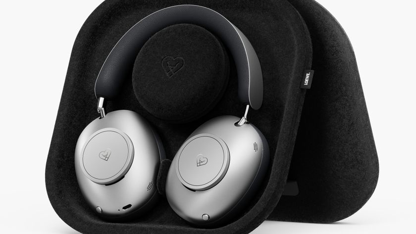 Loewe Leo wireless headphones in their black charging case