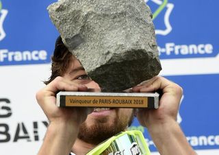 Peter Sagan holds up the cobble trophy as the winner of 2018 Paris-Roubaix