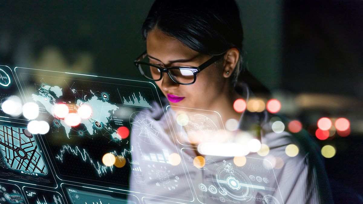 A woman examining on-screen data read outs