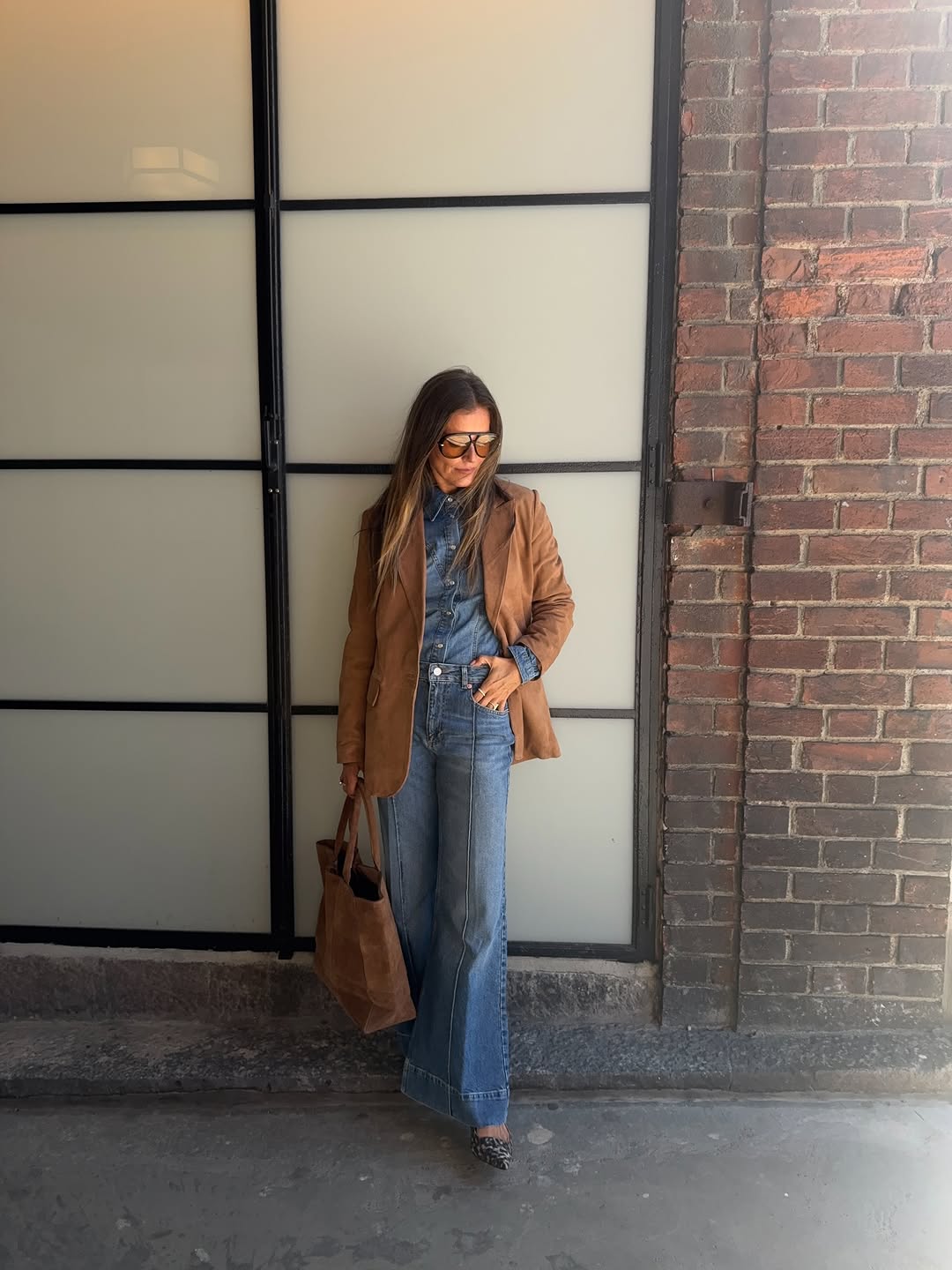 Woman wearing denim on denim outfit fall 2025.
