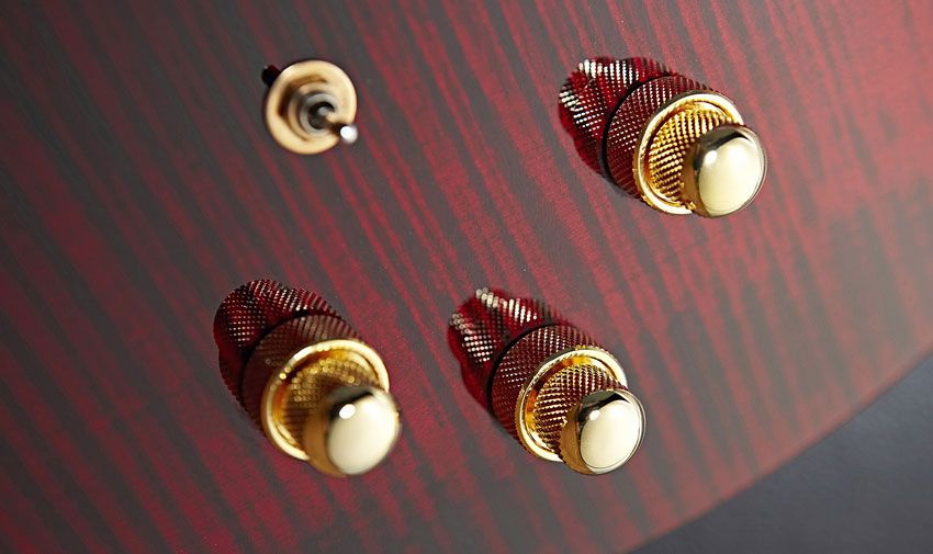 The stacked controls include a volume knob that handles MIDI and piezo sounds