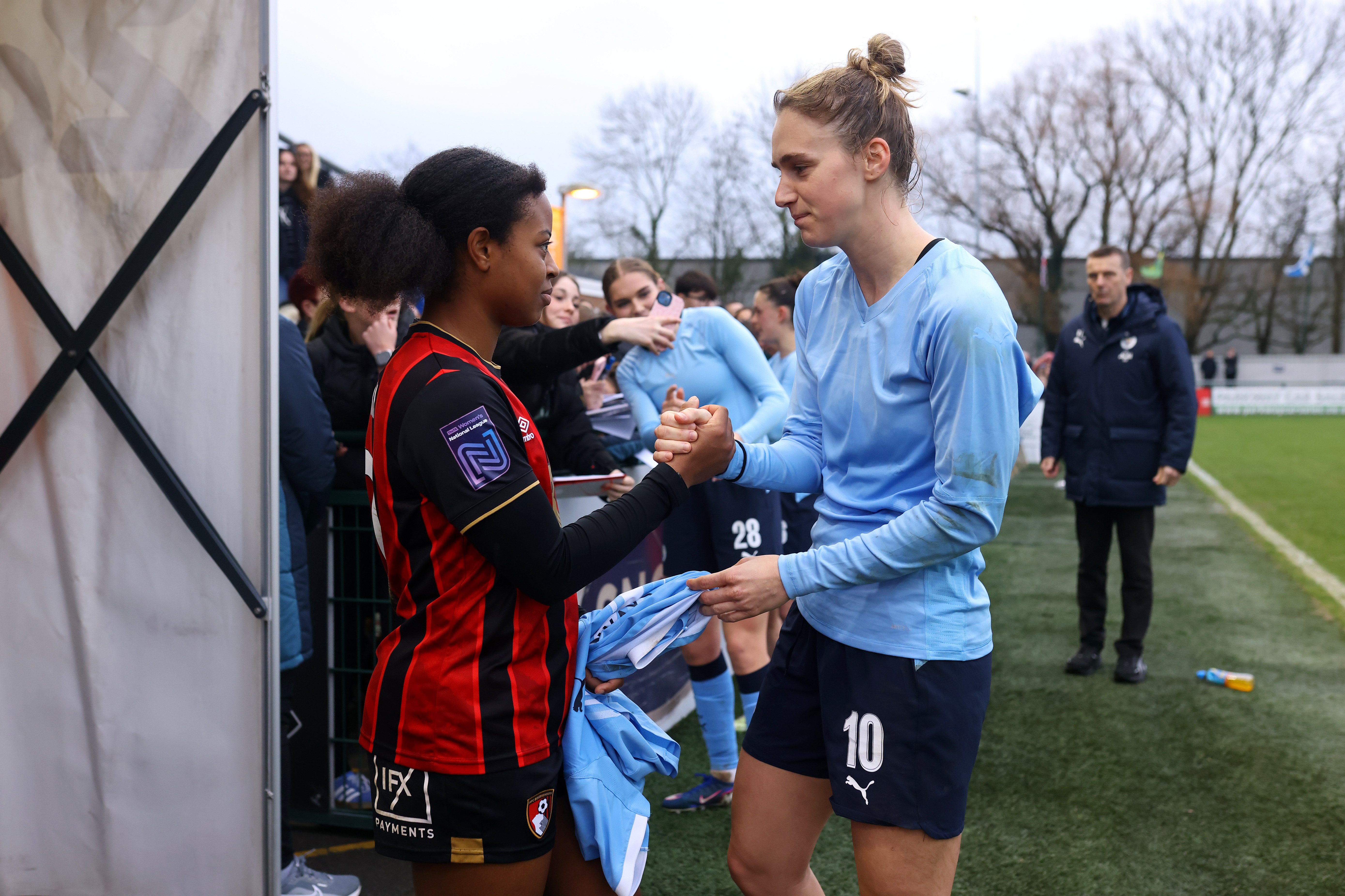 SOUTHAMPTON, ENGLAND - JANUARY 18: Kenni of Bournemouth AFC is given Vivianne Miedema of Manchester City shirt following the Adobe Women's FA Cup Fourth Round match between AFC Bournemouth and Manchester City at The Snows Stadium on January 18, 2026 in Southampton, England.)