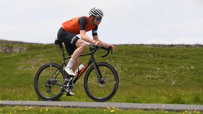 Image shows a rider wearing some of the best bib shorts for cycling