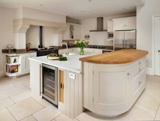 a kitchen with an island over two levels