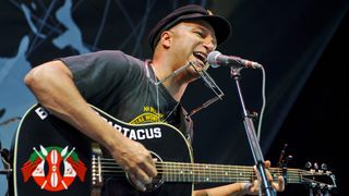 Well, he's got this guitar and he learned how to make it talk. Tom Morello aka The Nightwatchman on stage in Michigan, 2011.