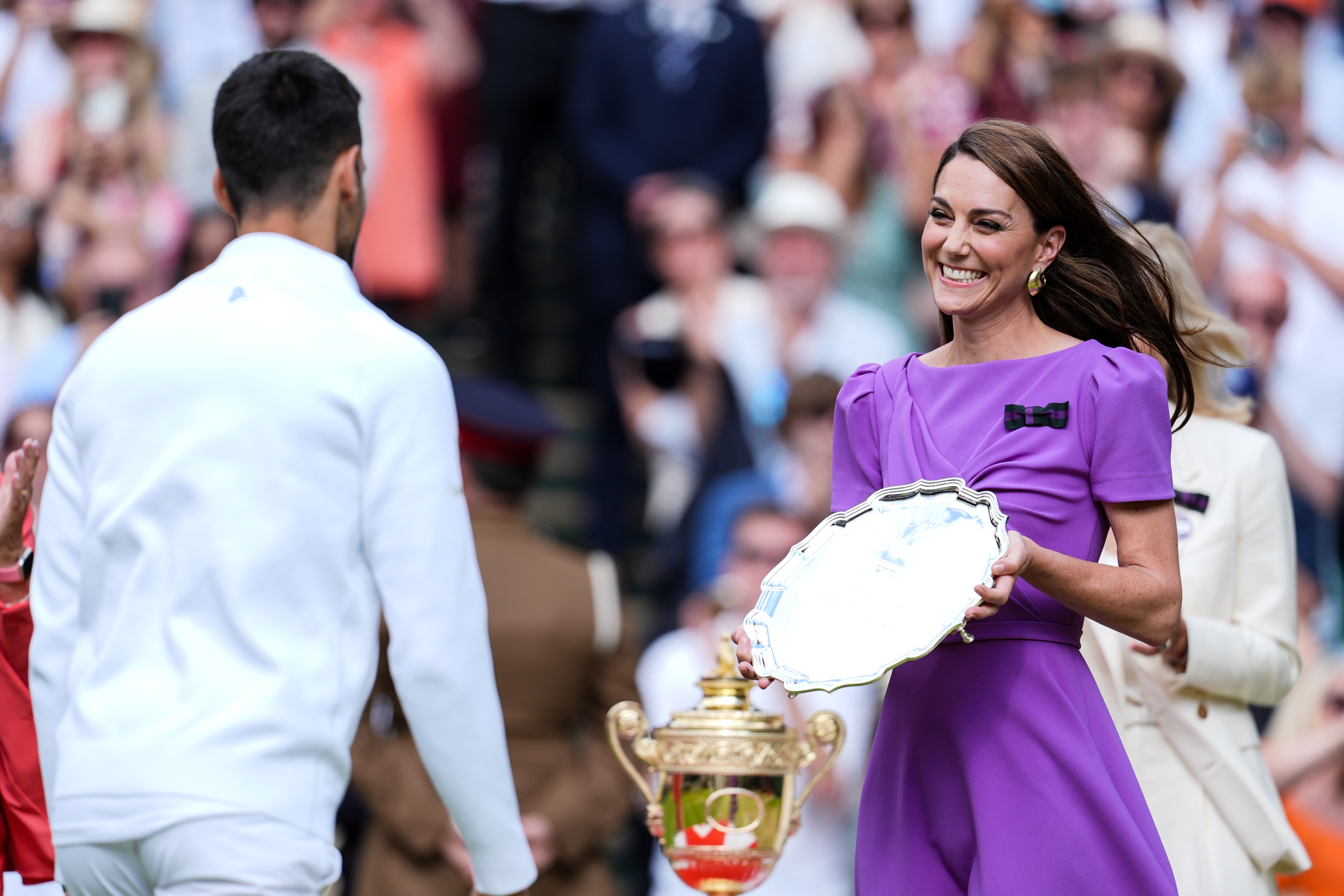 Catherine, Princess of Wales gives the runner-up's trophy to Novak Djokovic of Serbia during the ceremony after the Men's Single Final Match during day fourteen of The Championships Wimbledon 2024
