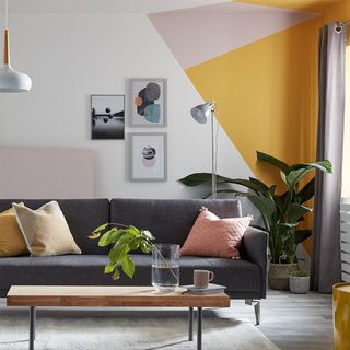 retro living room with diagonal paint effect in yellow and grey