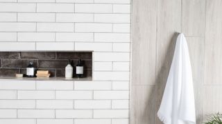 alcove in tiled bathroom wall
