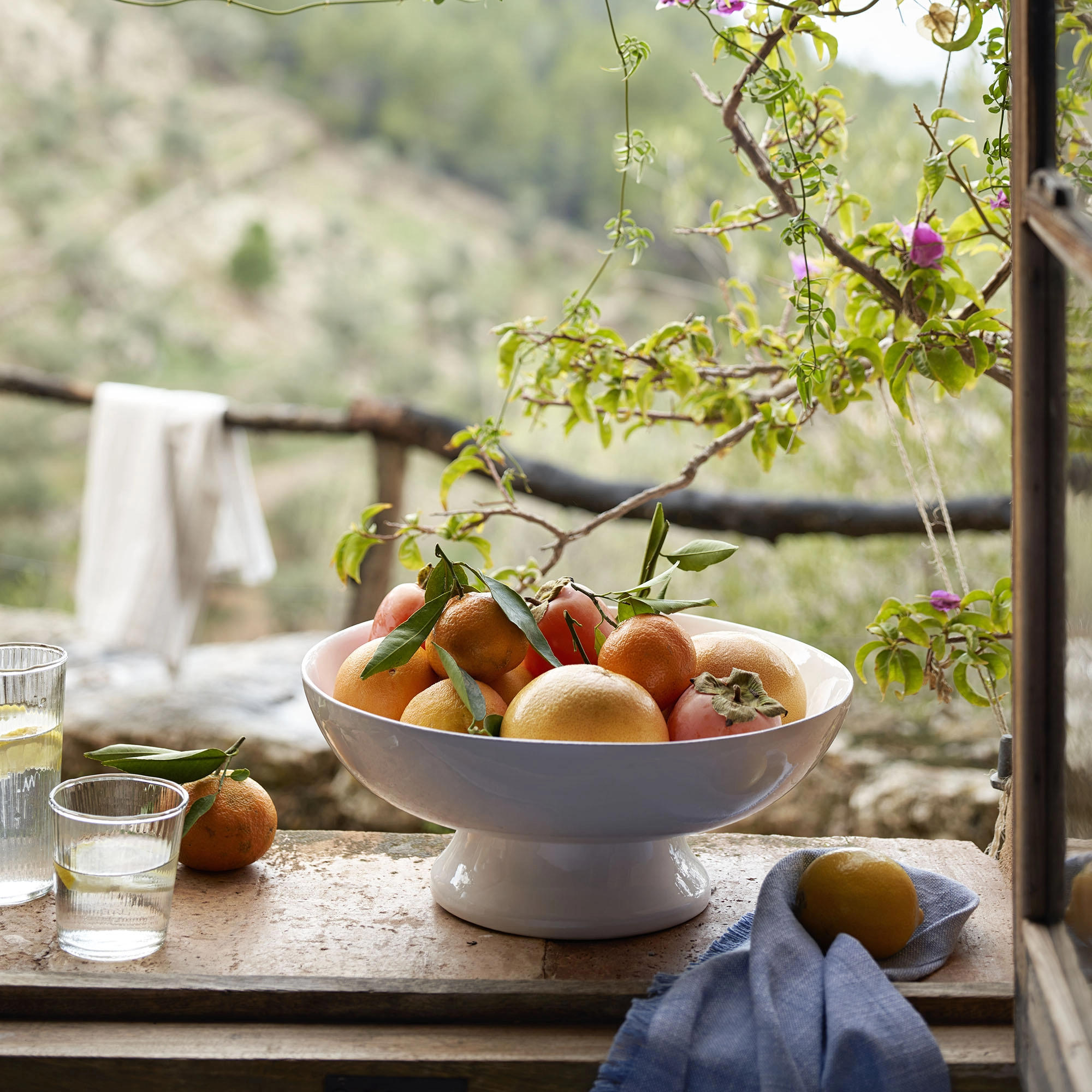 Footed serving bowl with fruit
