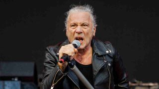 Bruce Dickinson performing onstage with Iron Maiden in 2025