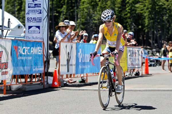 Marra Abbott (Peanut Butter &amp; Co) crosses the finish line after going solo on the climb